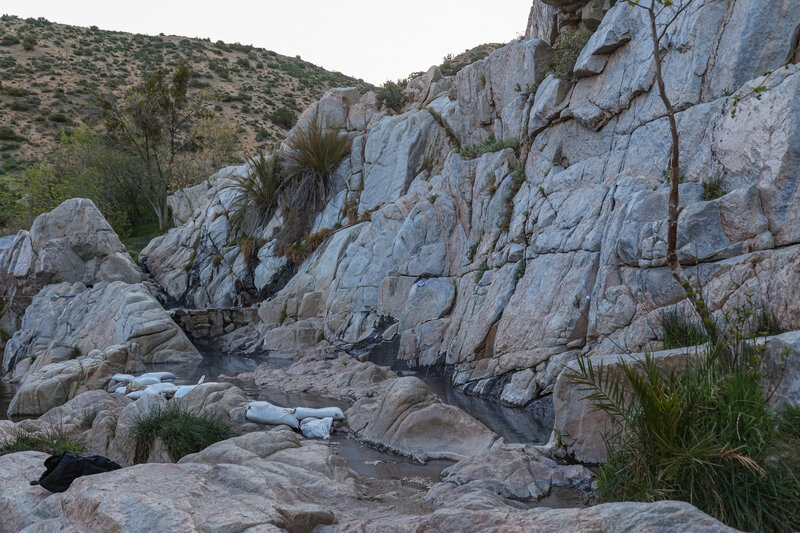 Several of the hot springs pools, each at varying temperatures, in the rocks at Deep Creek Hot Springs.