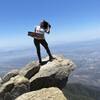 Standing at Cucamonga Peak with views of the valley below.