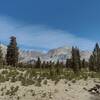 Rocky chutes and spires of Mt. LeConte, 13,931 ft., are left of center in the distance. Just right of center is Mt. Langley, 14,042 ft.  Seen looking northeast high on the Siberian Outpost ridge stretch of the PCT.