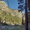 1500+ foot cliffs rise above the west banks of the Kern River, as the trail travels at the Kern Canyon bottom, through sequoias along its east banks. At Kern Hot Springs, look closely (bottom center) to see the hot springs hot tub in the meadow.