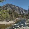 East bank cliffs of Kern Canyon, rise above the Kern River near Rattlesnake Point.  Although the east bank cliffs aren't as steep as the west bank cliffs, they are almost 3,000 feet high here.