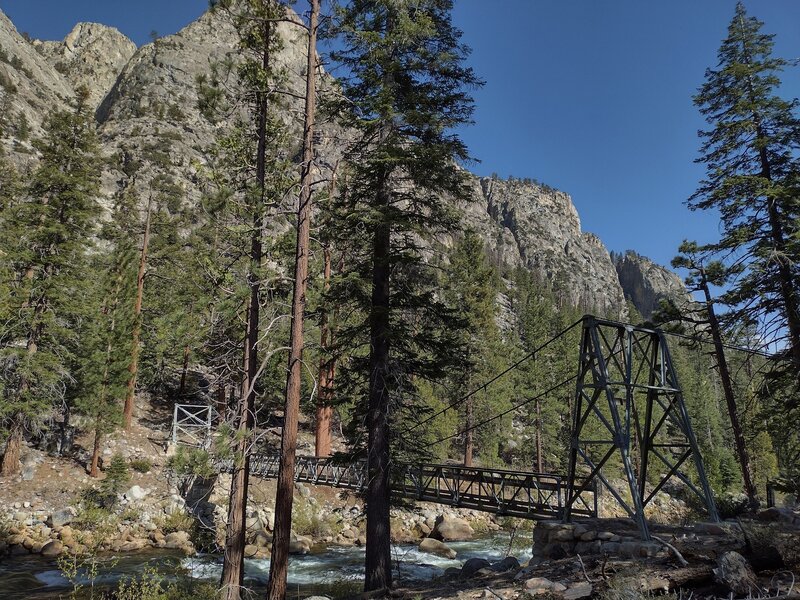 The Lower Kern Bridge from its west end. Kern River below, east side Kern Canyon cliffs rising 2,000 feet. Tower Rock, 8.469 ft. (center left) towers over the bridge.