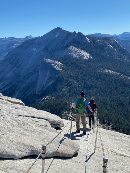 Descending the Half Dome cables. Clouds Rest is in the distance.