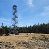 Small clearing at the summit with the rangers station a few picnic tables and the Hunter Mountain Fire Tower.