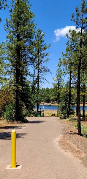 Entry to paved 1.1 mile loop around the lake.