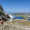 Descending past snowfields to Lac Cornu