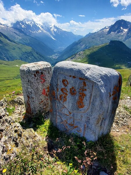 Old stone markers distinguish the border between France and Switzerland.