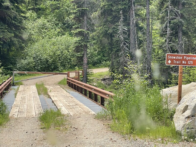 The sign for the trail is state issued. The next two attempting to look official are actually owned by the land owners warning not to go further.