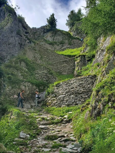 Super steep stone switchbacks to descend a cliff area.