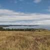 San Juan Islands and lighthouse in the distance on the southeastern point of San Juan Island.