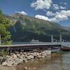 At the Canada/USA border looking east across Upper Waterton Lake, the dock and Parks boat that carries tourists between Waterton Townsite, Waterton National Park, Canada and Goat Haunt, Glacier National Park, USA.