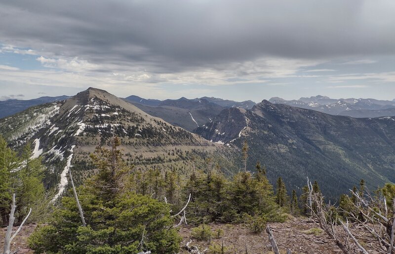 Looking east-southeast from the summit of Peak #4:  La Coulotte Peak (Peak #3 left) is connect to Peak #4 by the ridge running down the left, and connected to Peak #2 (center) and the Peak #1 (slightly right of center) by high ridges of the Great Divide.