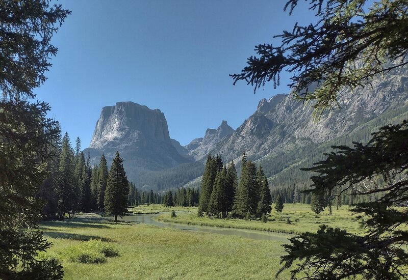 South of Upper Green River Lake, the Green River meanders through meadows on its way to the lake, as Squaretop Mountain looms ahead.