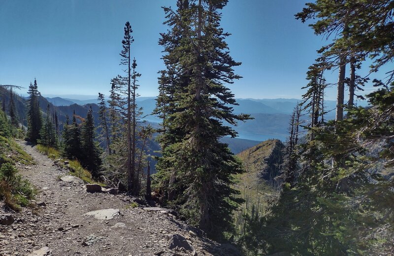 From the Lincoln Peak ridge crest, the view down the north side of the ridge with Lake McDonald in the distance.