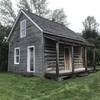 A log cabin near the historical society building.