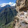 A precarious section of the trail cut into the vertical rock.