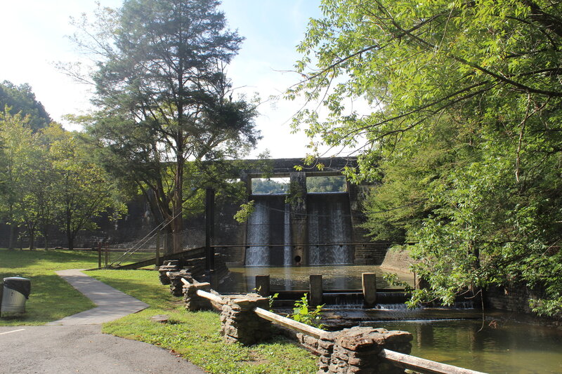 View of the bridge with the damn and spillway in the background.