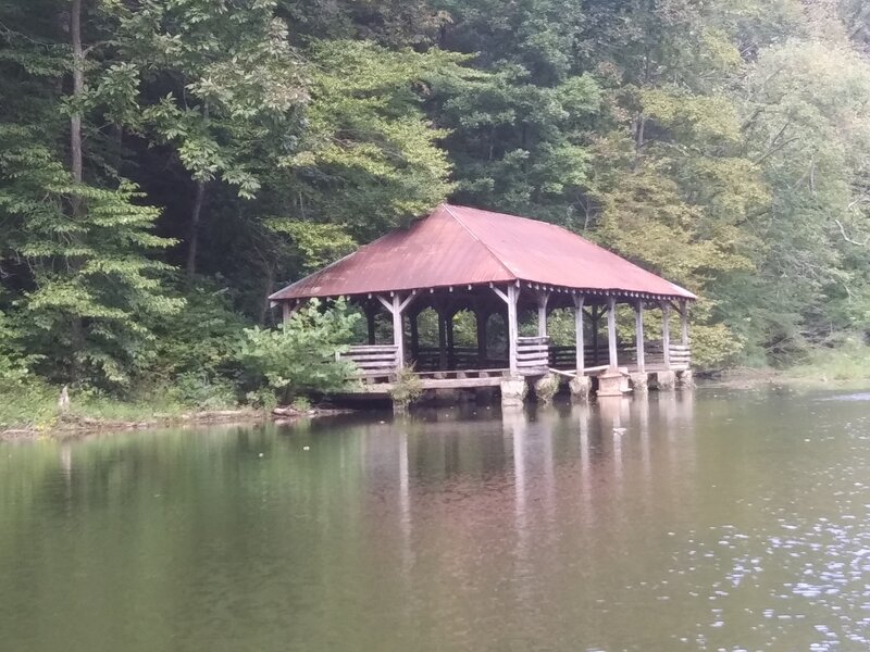 Looking at one of the two unused boat houses on the lake, this one further from the dam and used boat house and in quite a state of disrepair.