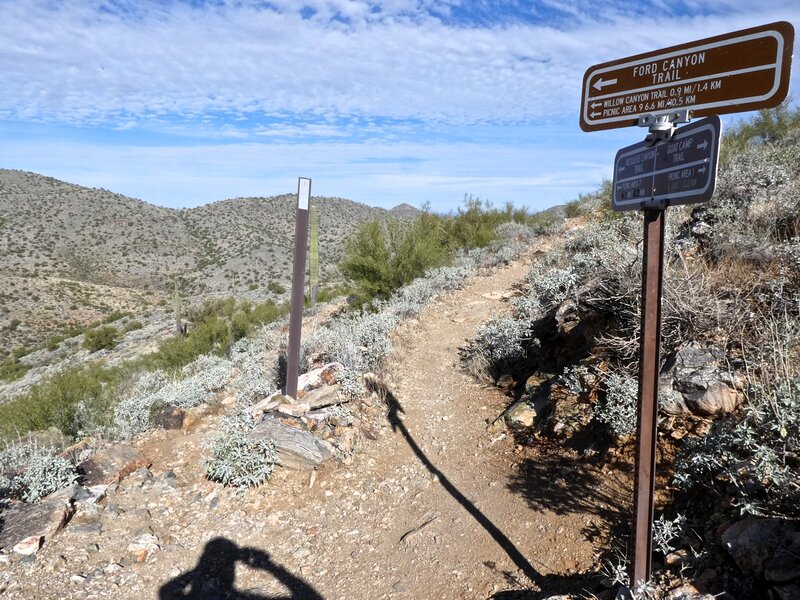 Mesquite trail on right of signpost, Ford Canyon on left trail heading down past sign post.