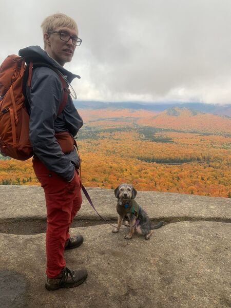 Second muddy doggy contemplating life choices at Mt. Van Hoevenburg Summit.