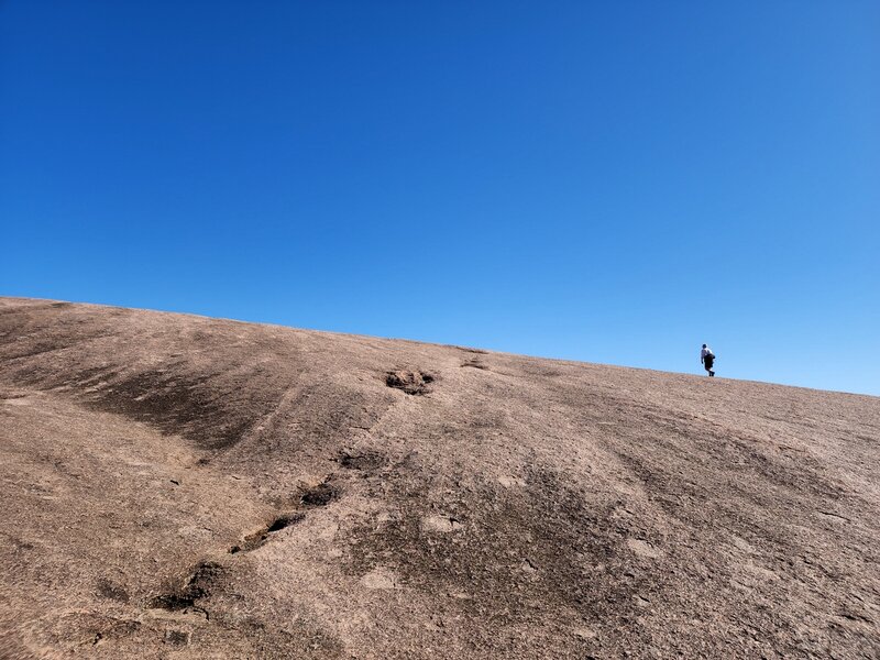 Walking up Enchanted Rock toward its summit.