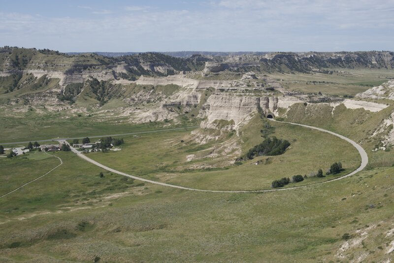 Views of the visitor center, monument road, and surrounding area from the South Overlook.