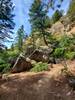 Big pile of boulders at a bend in the trail.