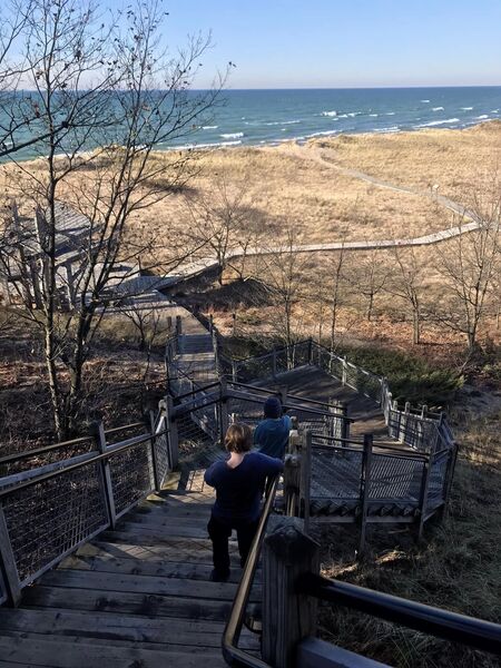 Stairs down the front side of the down, out towards the beach.