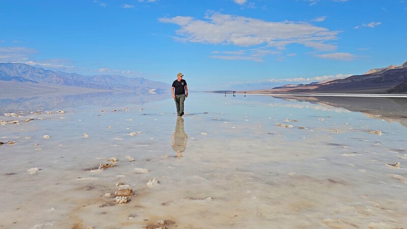 Walking on a water filled Badwater Basin.