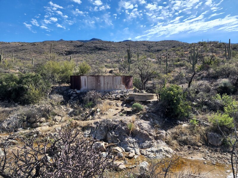 The large steel and small concrete tanks.