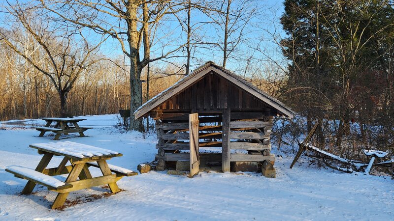 Play house and picnic tables near Jacob Moery Cabin in the winter.