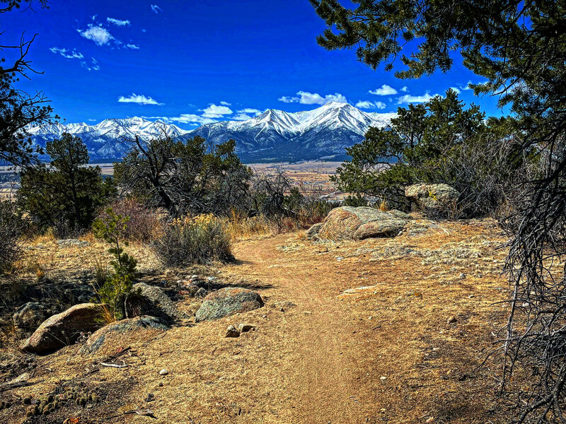 Smooth singletrack and snow-covered peaks.