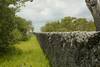 The trail provides views of a wall that was built when the Honeywells built their vacation resort there.