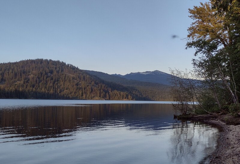 Upper Priest Lake is surrounded by Idaho's Selkirk Mountains, as seen looking east-southeast from Navigation Trail camp, on a late June evening.