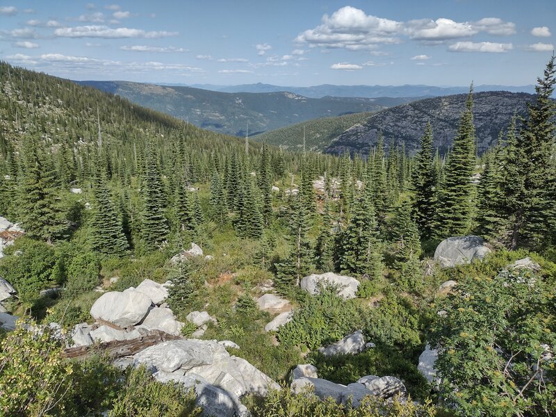 Mountains nearby, and far into the distance, looking east from high on Fault Lake Trail.