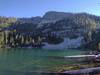 Last evening sunlight tickles the tree tops as beautiful Snow Lake and its mountains slip into the shadows of night.