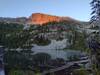 Dawn at Snow Lake, as the sun's rays light up the top of the unnamed peak that watches over Snow Lake.