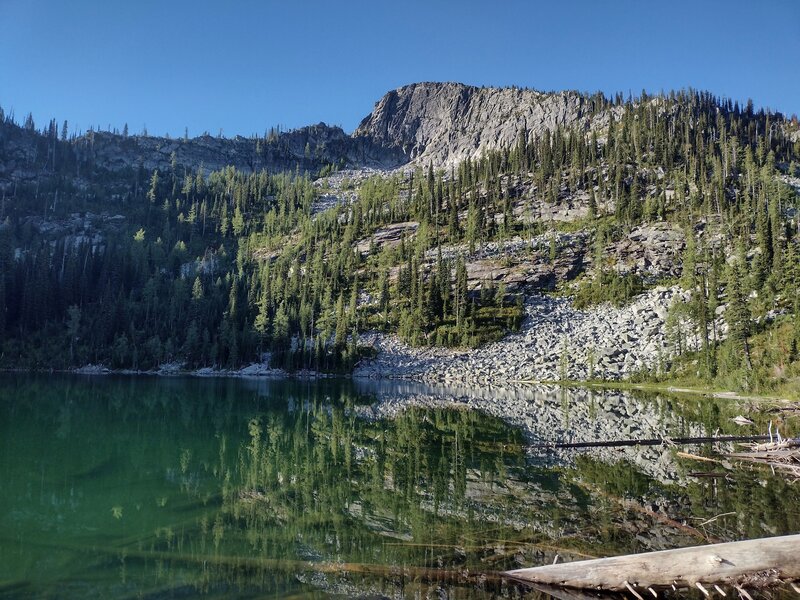 Early morning at Snow Lake. As the clear blue-green lake waters fade into the mountain reflections - it doesn't get any better. Waking up to this is why we backpack.