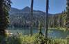 Bottleneck Lake in the pretty, sunlit forest, is a sparkling, alpine gem in the cirque below Bottleneck Peak, 6,782 feet.