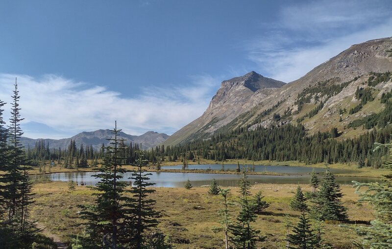 Jackpine Mountain, 8,383 ft. (center right), on the Great Divide, looms over Blueberry Lake set in a pretty alpine meadow.