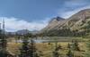 Jackpine Mountain, 8,383 ft. (center right), on the Great Divide, looms over Blueberry Lake set in a pretty alpine meadow.