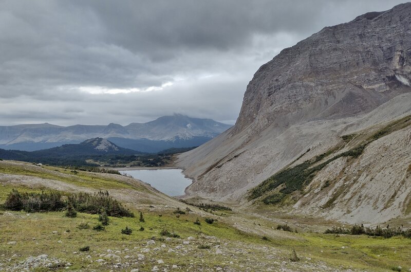 Cute, little tarn at the base of Bastille Mountain, 8,350 ft. (right), is very close to Surprise Pass on its south side.