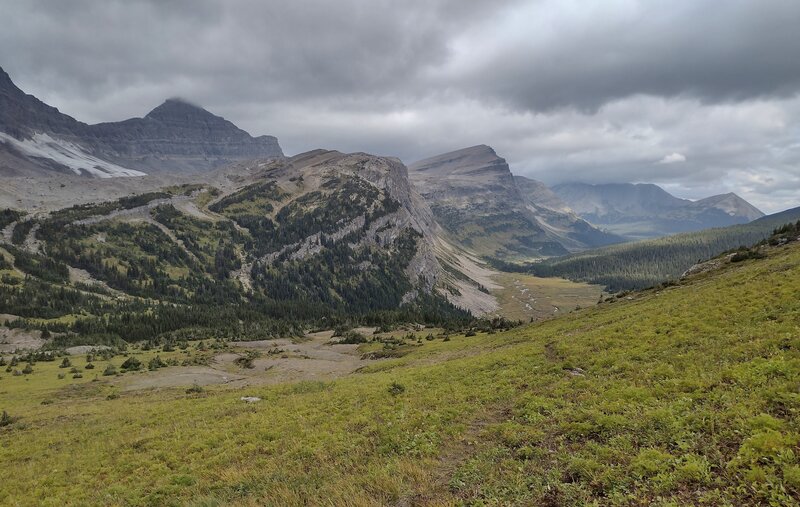 View to the north, heading down from Surprise Pass. Creeks in the valley below (center right) flow into Cecilia Lake that is out of sight behind the forested ridge on the right.