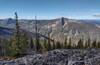 From Fisher Peak, looking northwest, Parker Ridge is nearby on the far side of Parker Creek in the deep valley below. Parker Peak, 7,651 ft. (center right), is the high point on Parker Ridge. Far distant mountains on the right, are in Canada.