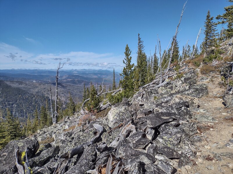 Fisher Peak Trail (right) and ridges of mountains (left) far into the distance, Canada, to the northwest.