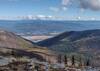 Kootenai River in its broad valley. Distant Purcell Mountains beyond. Seen looking east from Fisher Peak.