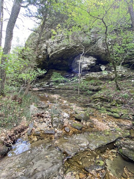 Creek crossing near rock overhang.