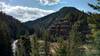 The Coeur d'Alene River (left) shimmers as it flows through the forested mountains and their impressive rock outcroppings.