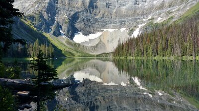 Rawson Lake is nestled in the forest below Mount Sarrail.