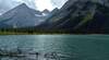 Upper Elk Lake. Glaciated peaks in the distance (left to right) - Mt. McCuiag (9,462 ft.), Mt. De Gaulle (9,686 ft.), Mt. Nivelle (10,683 ft.), and Mt. Casteinau (9.859 ft.). Nearby Mt. Elkan (9.056 ft.) upper right, rises from the lakeshore.